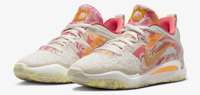 View of pink and orange Nike KD shoes.